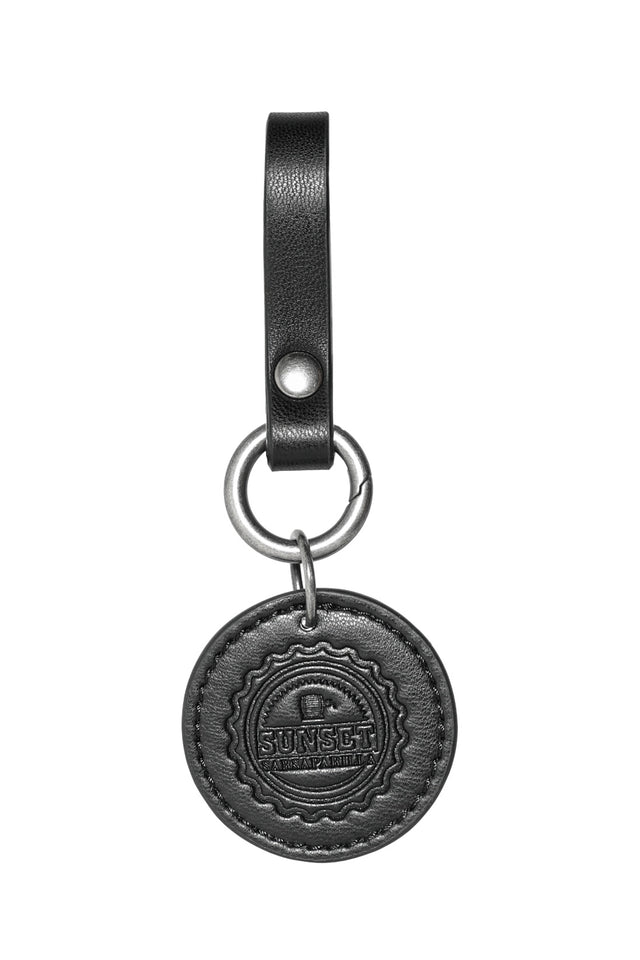 Fallout x BlackMilk belt charm set featuring five bottle cap designs inspired by in-game collectibles.
