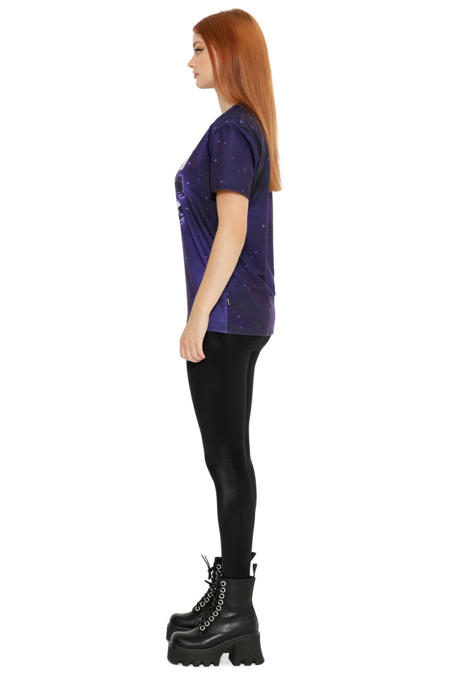 Galaxy-themed purple tee with soft star details and radiant cat moon phase artwork on the front, modelled with a relaxed fit.