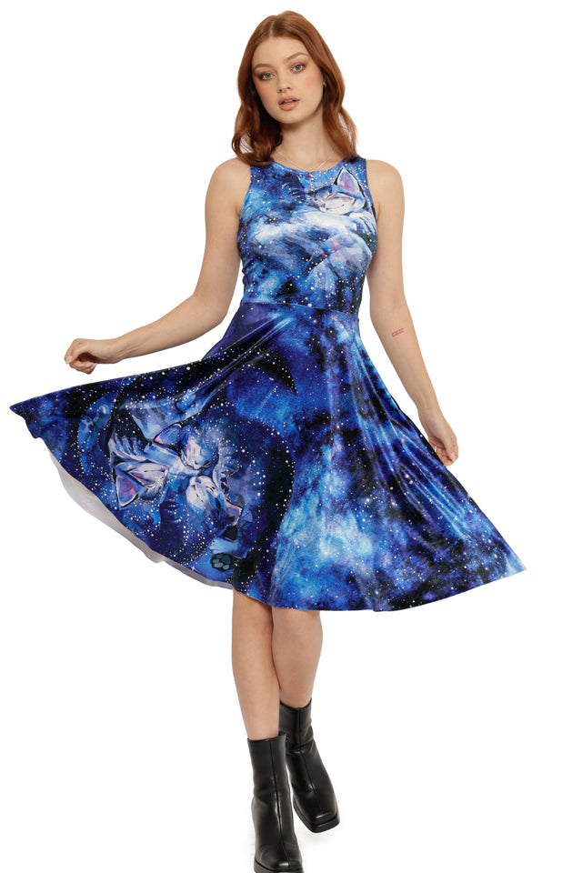 Woman wearing a blue butterfly dress on a white background