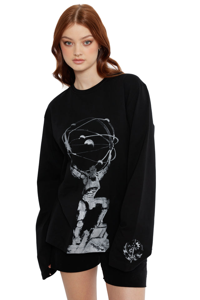 Model styled in Fallout x BlackMilk Chain That Binds Long Sleeve Tee showcasing silver Brotherhood statue design.