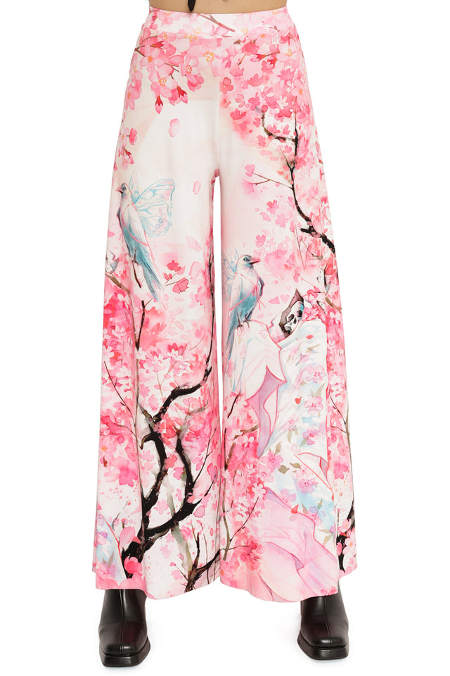 Wide-leg pants with cherry blossom and bird design on a white background