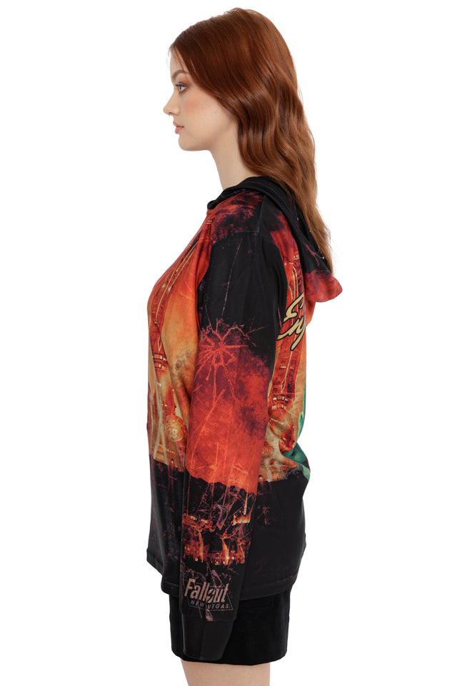 Model wearing Fallout x BlackMilk Enjoy Your Stay Hoodie with bold red Fallout New Vegas themed artwork.