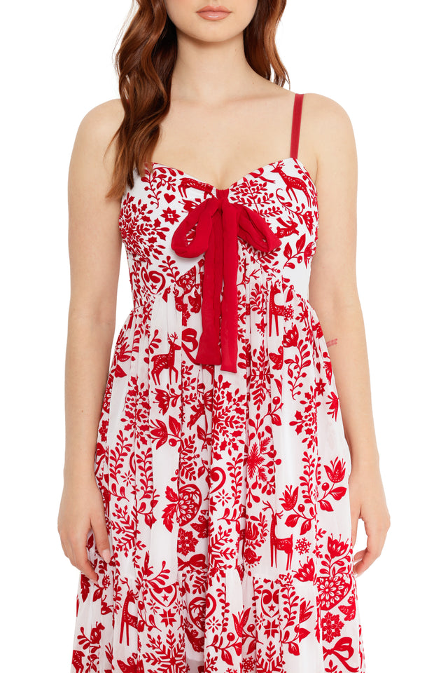 long christmas dress with red ribbon tie and festive print
