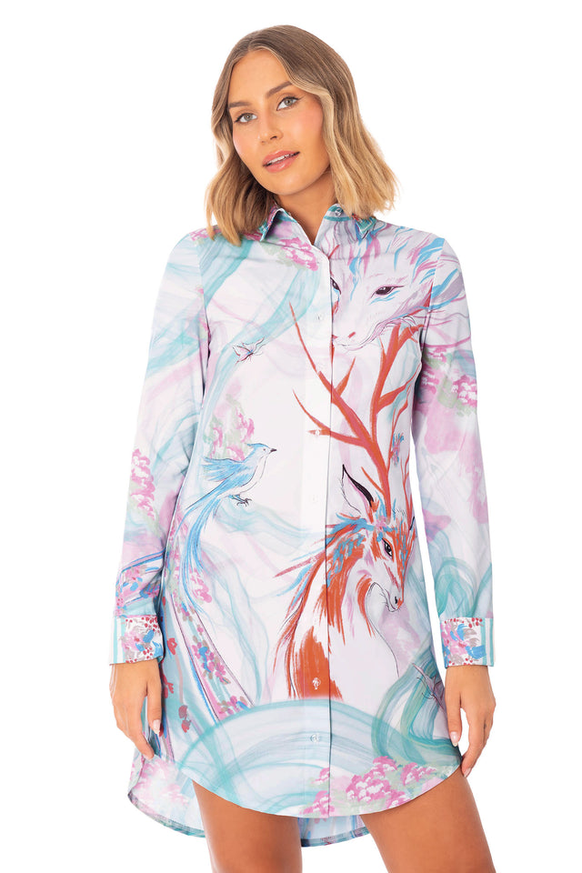 Printed long sleeve shirt dress with button front, curved hemline and pastel artwork featuring mythical creatures and birds