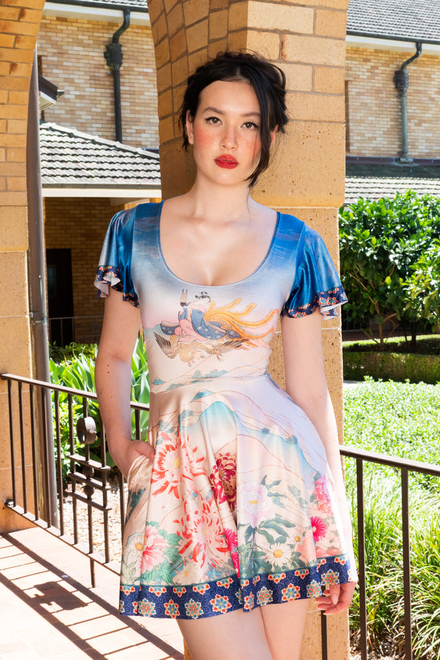 Golden Phoenix Flouncy Scoop Skater Dress front close view showing scoop neckline, flutter sleeves and phoenix inspired print in soft pastel tones