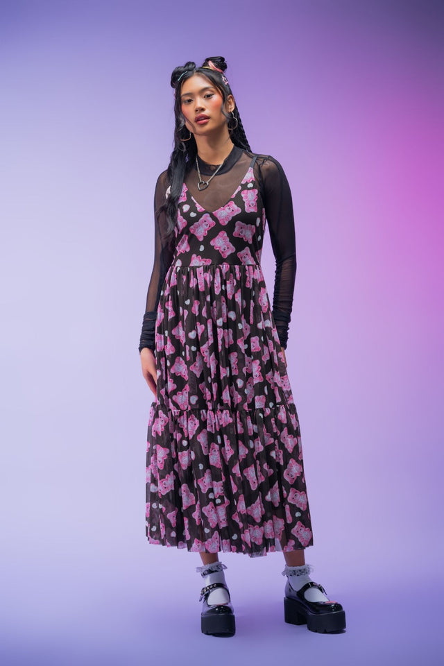Playful sheer black midaxi dress featuring colourful pink gummy bears across a floaty mesh overlay, adjustable straps, soft lining and a flattering layered silhouette perfect for alternative fashion.
