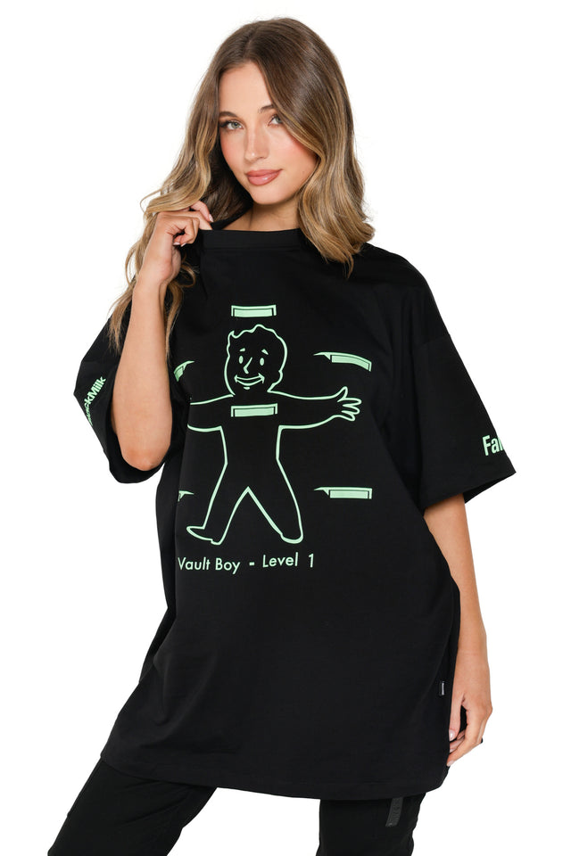 Oversized Fallout x BlackMilk tee with bright green Vault Boy stats print and relaxed silhouette.