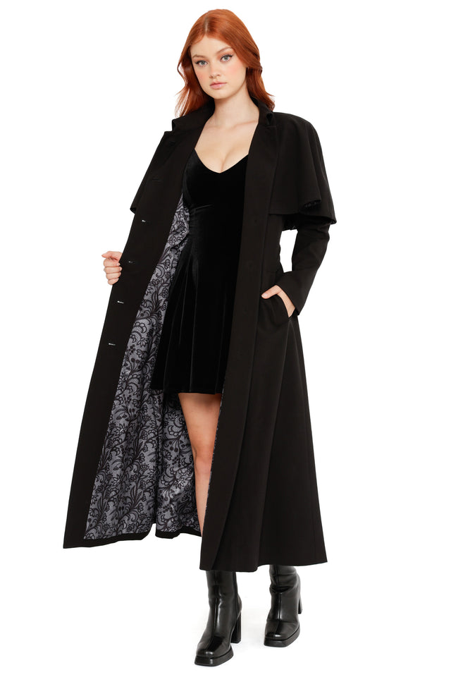 Front view of the Heathcliff Trench Coat, a black gothic 3 in 1 trench coat from the Wuthering Heights collection with flowing silhouette and lace lining detail