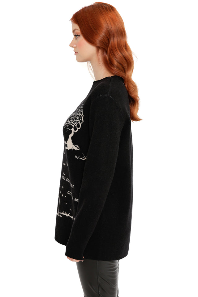 Model styled in the His and Mine High Neck Sweater, a Wuthering Heights collection knit featuring cream woven text, tree illustration and gothic romance aesthetic