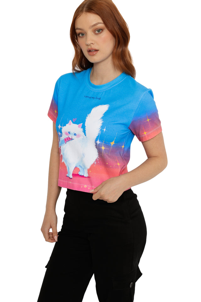 Person wearing a colorful t-shirt with a cartoon cat design on a white background