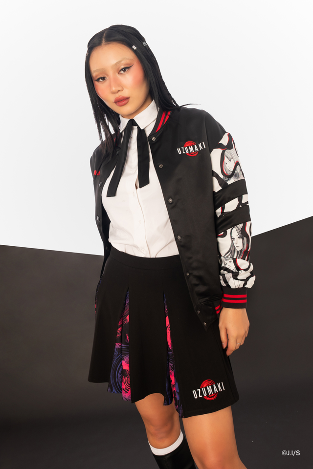 Junji Ito Uzumaki anime varsity jacket back view, red vortex spiral graphic with Kirie and Shuichi in gothic alternative streetwear style.