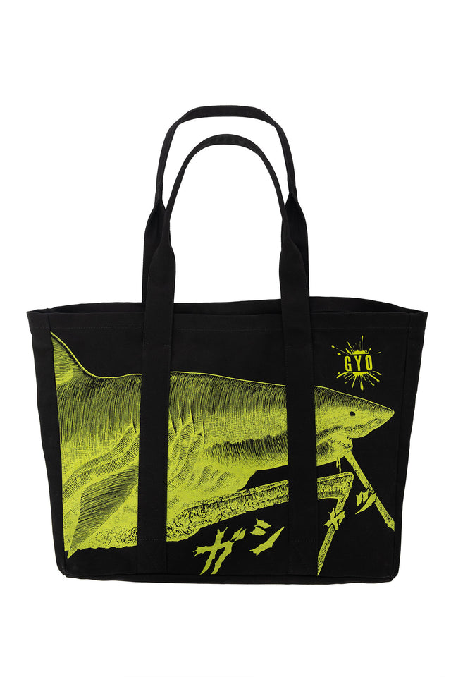Junji Ito x BlackMilk Shark Attack neon day bag inspired by Gyo, black canvas anime tote bag featuring biomechanical walking shark artwork in bright neon green, Japanese horror manga streetwear accessory.
