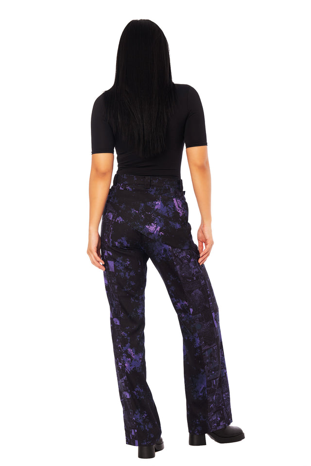 Front view of Junji Ito Uzumaki wide leg pants with adjustable overlapping panels and stacked manga print inspired by The House chapter 13.