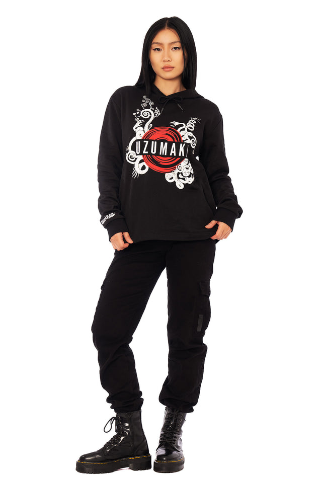Junji Ito anime inspired hoodie featuring iconic Uzumaki spiral artwork, black unisex cotton sweatshirt with bold red circular centre graphic and relaxed silhouette.