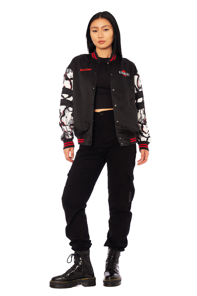 Junji Ito Uzumaki varsity jacket back design showing red spiral curse illustration of Kirie and Shuichi, satin bomber style in Japanese horror fashion.