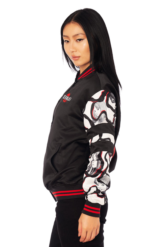 Junji Ito clothing Uzumaki varsity bomber jacket featuring back spiral vortex design, Kirie and Shuichi artwork, and contrast manga panel sleeves.