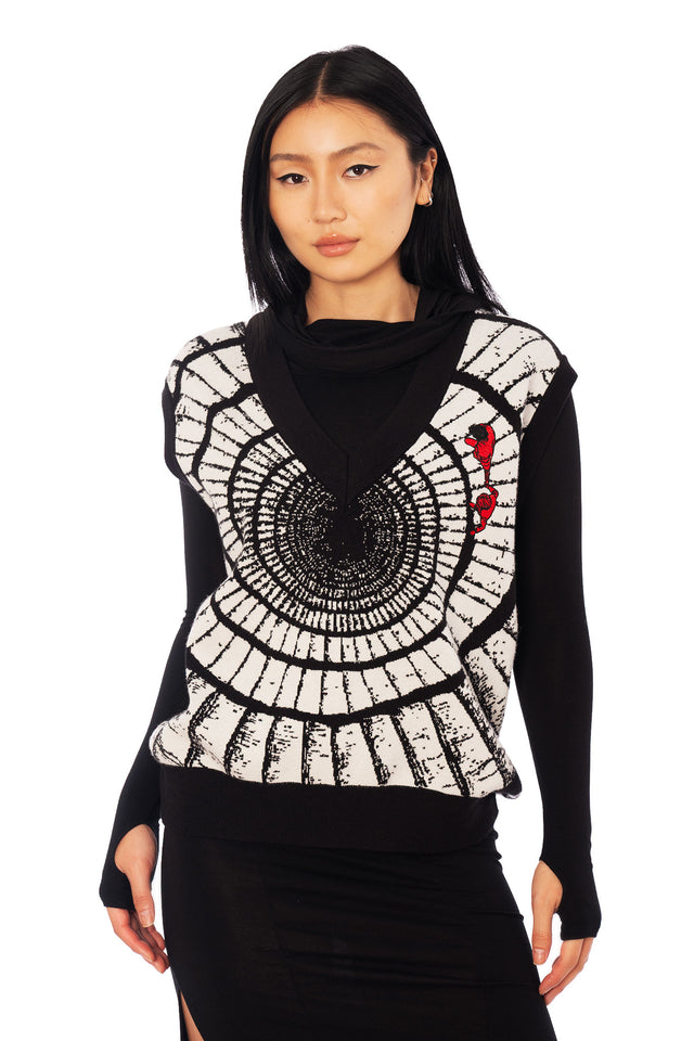 Uzumaki spiral knit vest from the Junji Ito x BlackMilk collaboration, oversized black and white sweater vest with gothic manga artwork.