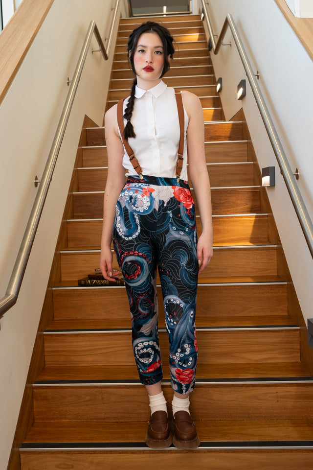 Lurking Beneath Cuffed Pants front full length view showing fitted printed pants with octopus tentacle artwork and cuffed ankle detail
