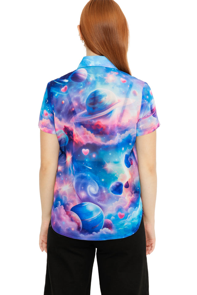 Pastel galaxy print shirt with blue, pink and purple hues, scattered planets and subtle heart details.