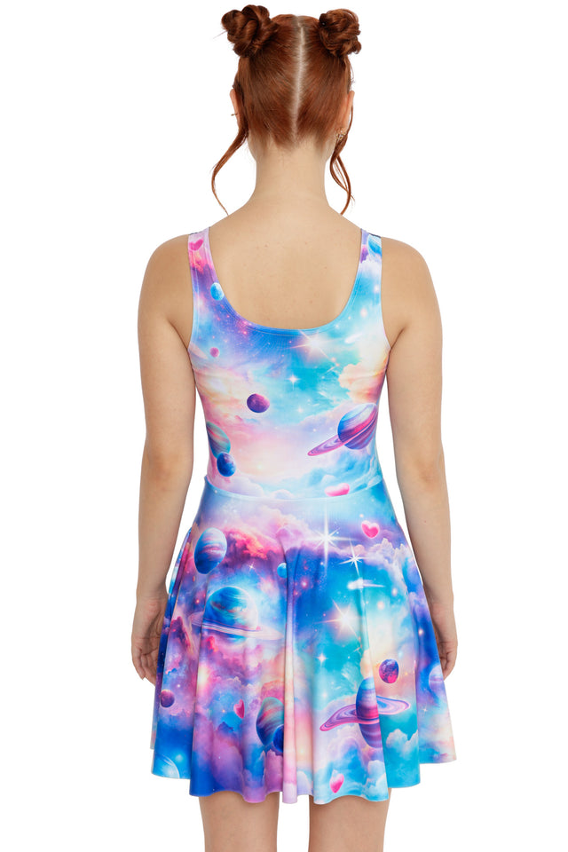 Pastel galaxy dress with planets and dreamy cloud textures on a fitted skater silhouette