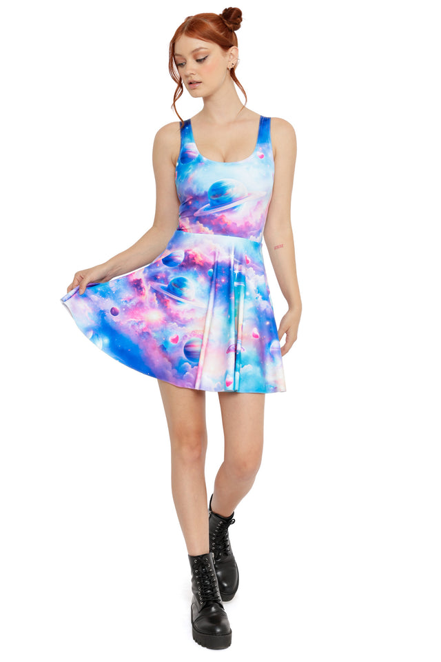 Colourful space print skater dress featuring planets, nebula clouds and soft pastel tones