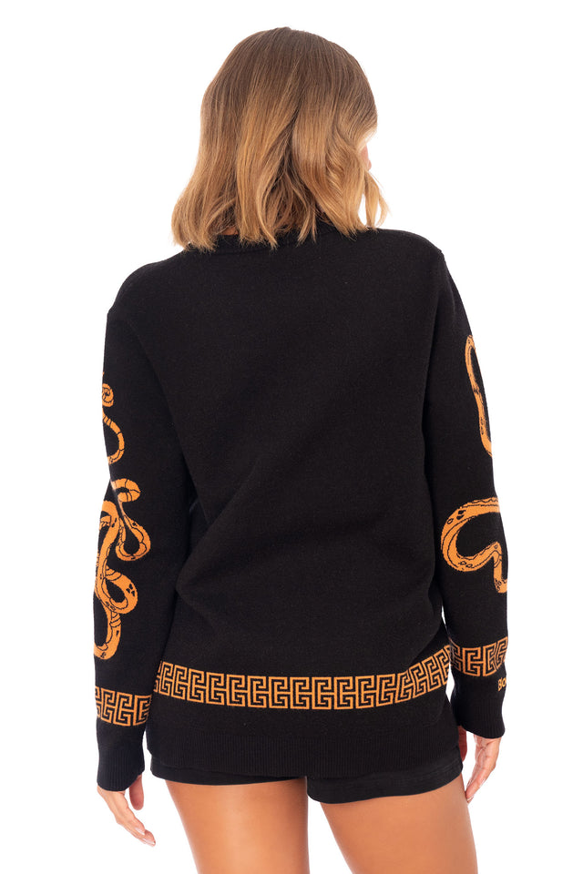 Oversized black Medusa Crew Knit Sweater front product image featuring soft knit fabric, relaxed fit, long sleeves, Greek mythology Medusa face design and contrast orange detailing