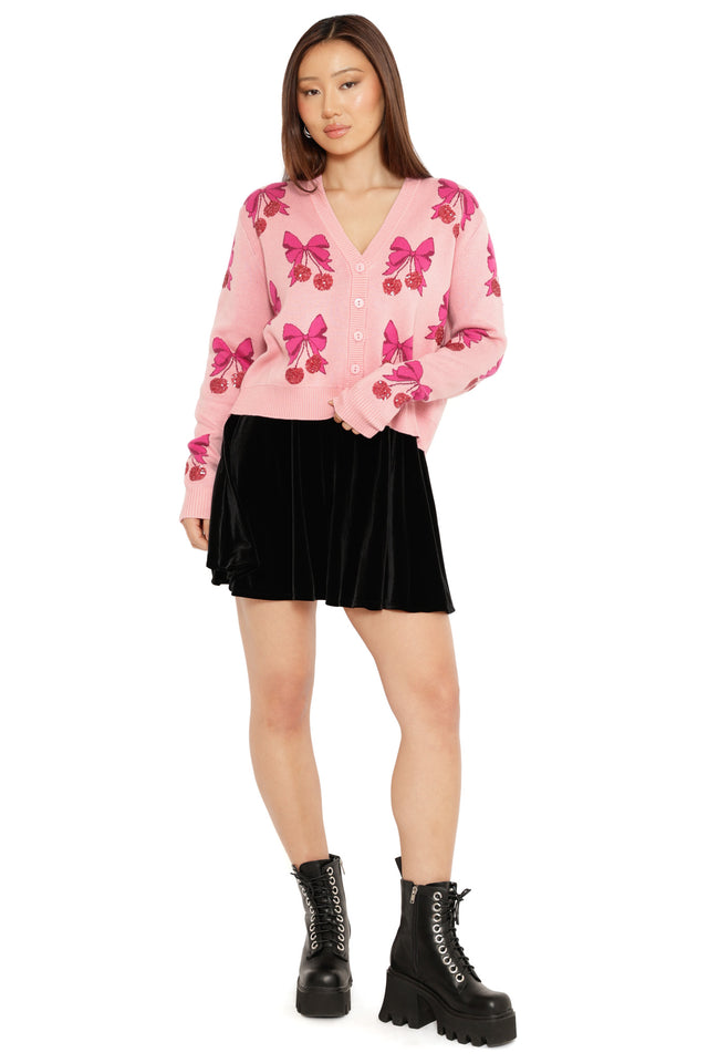 pink christmas cardigan with berry and bow design festive knitwear