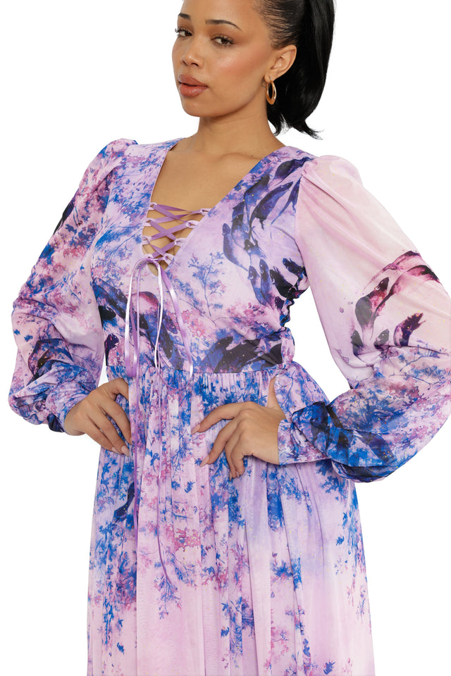 Woman wearing a floral dress with a white background