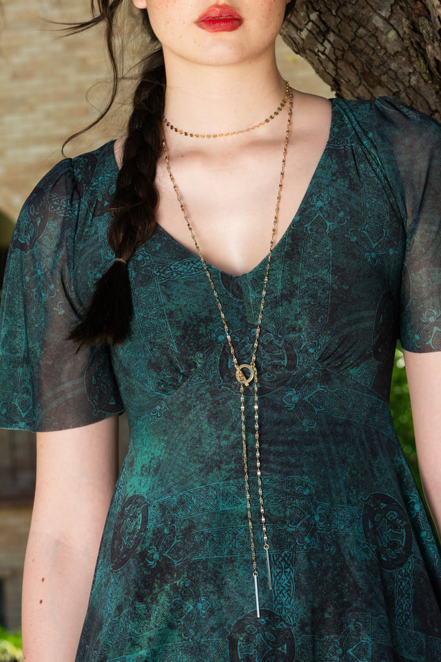 Women’s Moss Maiden Handkerchief Short Sleeve Dress featuring dark green fantasy inspired print, sheer overlay, flutter sleeves and asymmetrical handkerchief hem