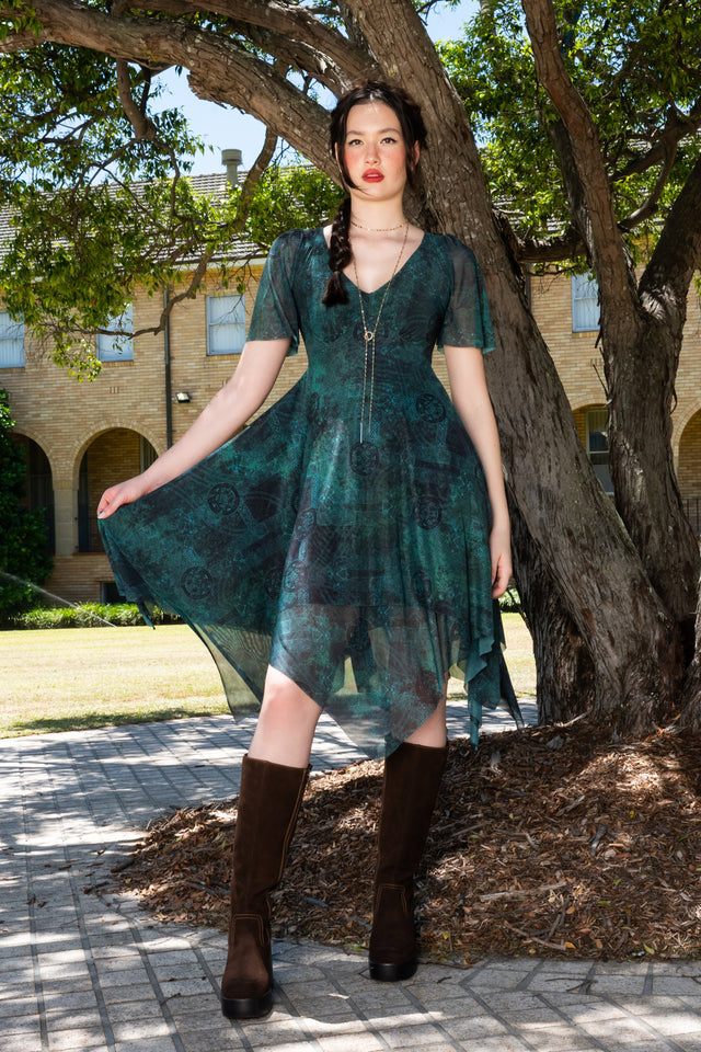 Moss Maiden Handkerchief Short Sleeve Dress front view showing green printed dress with soft flutter sleeves, v neckline and flowing handkerchief hem silhouette
