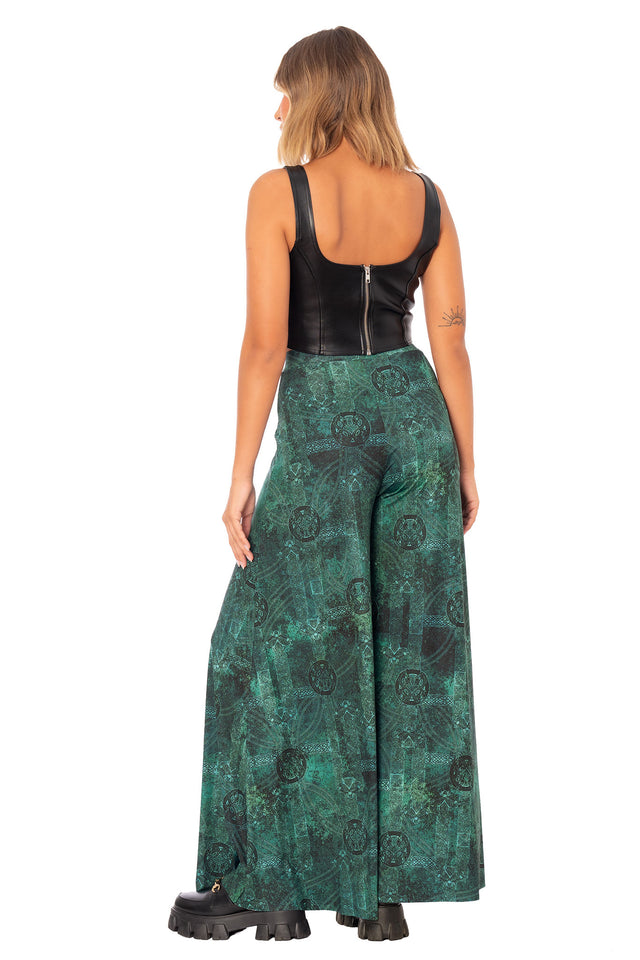 Women’s palazzo pants featuring wide leg fit, high waist and moss green woodland inspired print