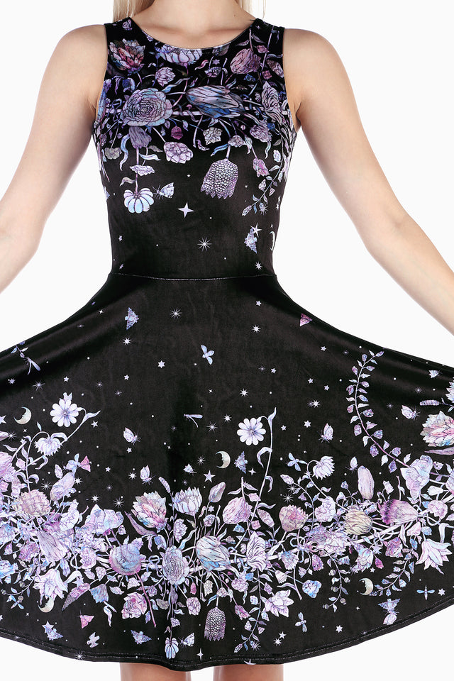 Model wearing Mother Of Pearl Velvet Princess Longline Dress by BlackMilk Clothing, black velvet longline dress with pastel floral and moon star print