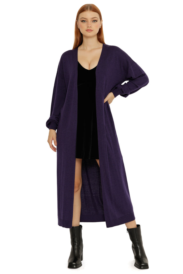 Full-length Midnight Super Cardigan in deep navy, worn open over a black dress with long sleeves and a relaxed fit.