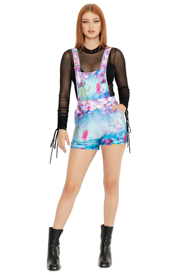 Pastel space print short overalls with alien artwork, featuring colourful planets and playful sci-fi details