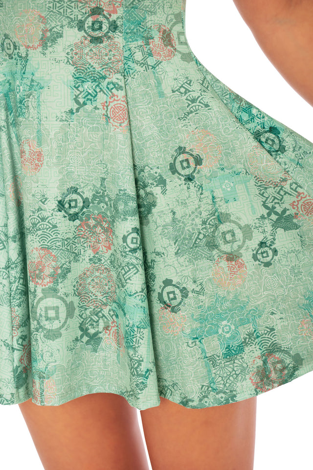 Fabric close up of Avatar: The Last Airbender x BlackMilk dress with Ba Sing Se inspired Earth Kingdom print, official licensed Avatar fashion clothing