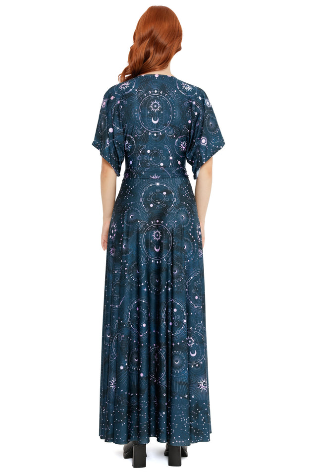 Dark navy wrap dress with soft drape, short sleeves and intricate constellation and moon motifs throughout.