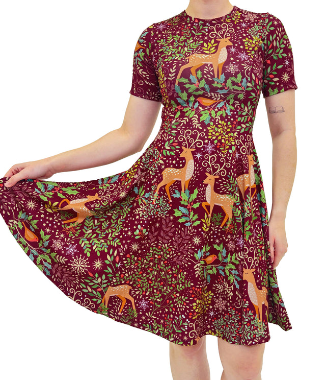 Dress with deer and floral pattern on a white background