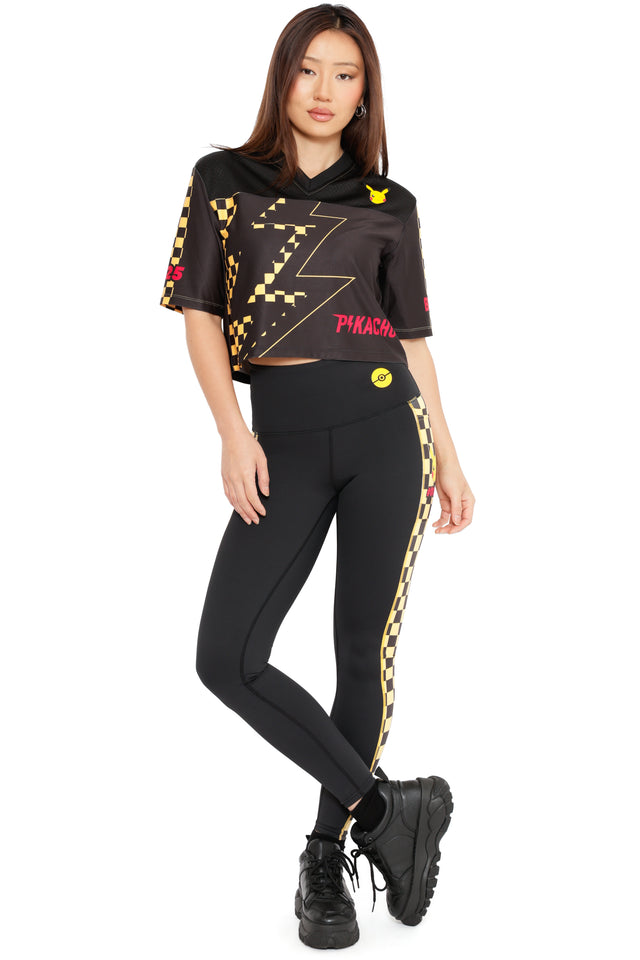 Pikachu Nostalgia Crop Touchdown top by BlackMilk, cropped Pokémon jersey style top in black with yellow lightning bolt graphic and Pikachu icon