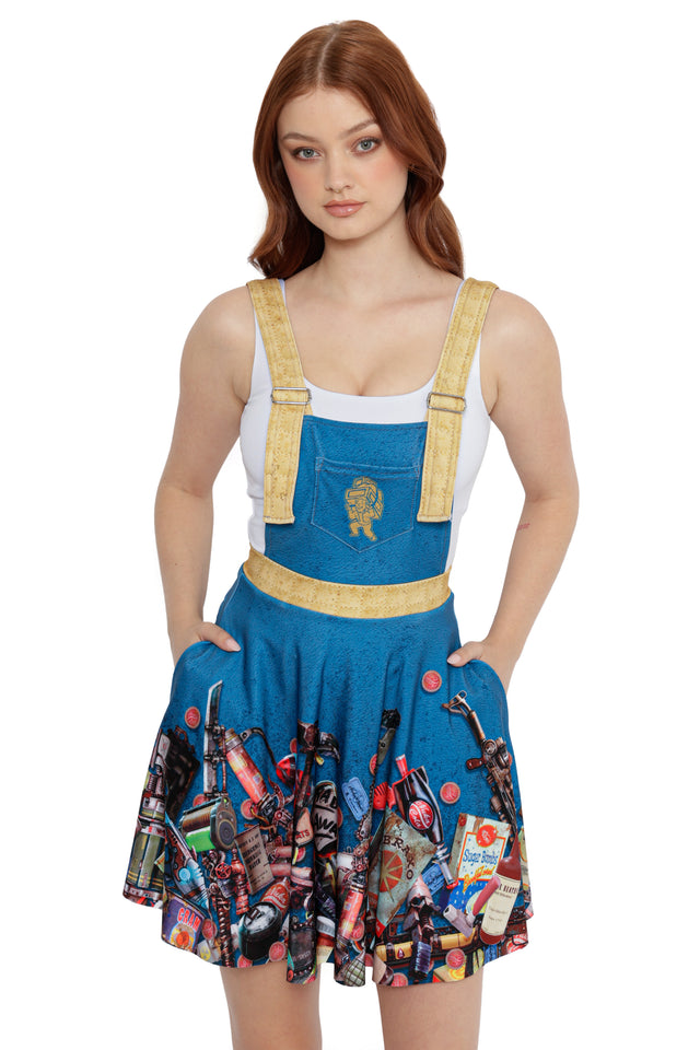 Model wearing Fallout x BlackMilk Pack Rat Apron Dress showcasing Fallout-inspired tools, bottle caps and Nuka-Cola artwork.