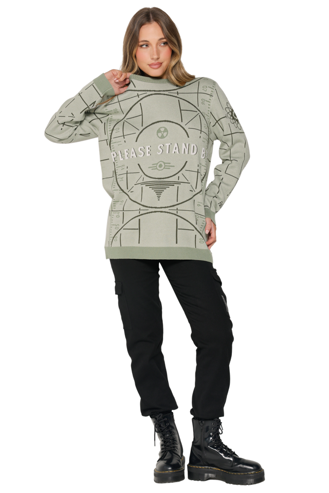 Model wearing Fallout x BlackMilk Please Stand By Knit Sweater featuring green test screen pattern.