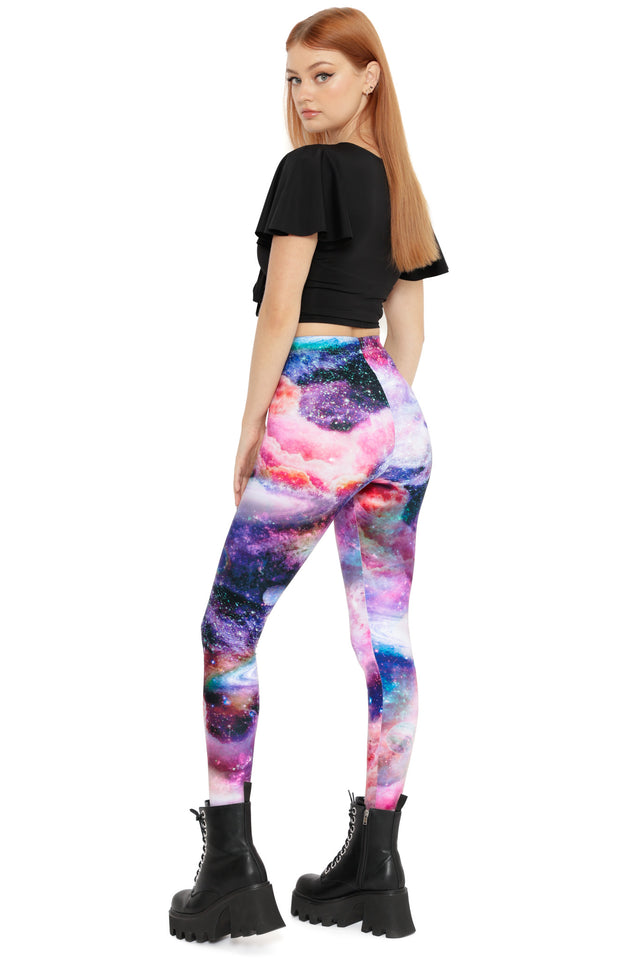 Cosmic leggings featuring vibrant galaxy artwork in pink, purple and deep space tones