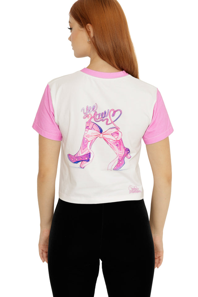 Cropped baby tee from the Lora Zombie collection, designed with a white body, pink trim, and whimsical rat girl artwork.