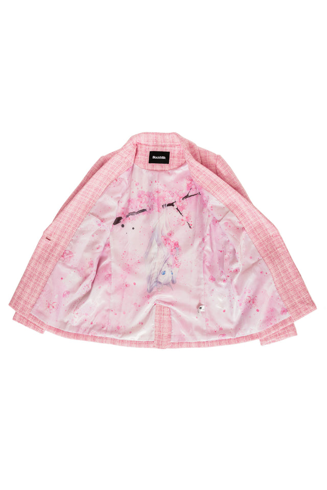 Pink floral blazer with a floral lining featuring a white bat and cherry blossoms with a brand label on a white background
