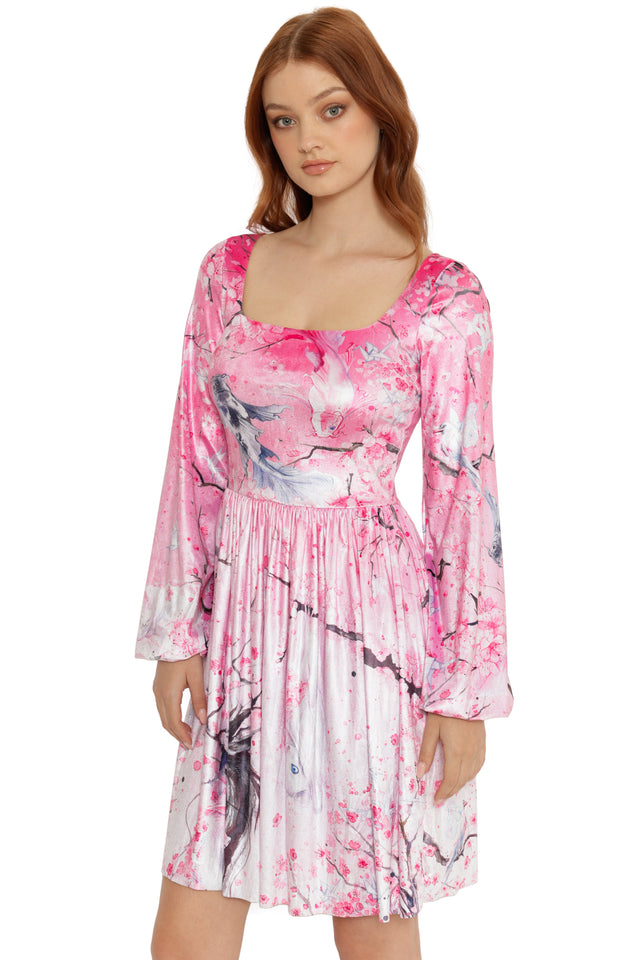 Woman wearing a pink floral dress on a white background