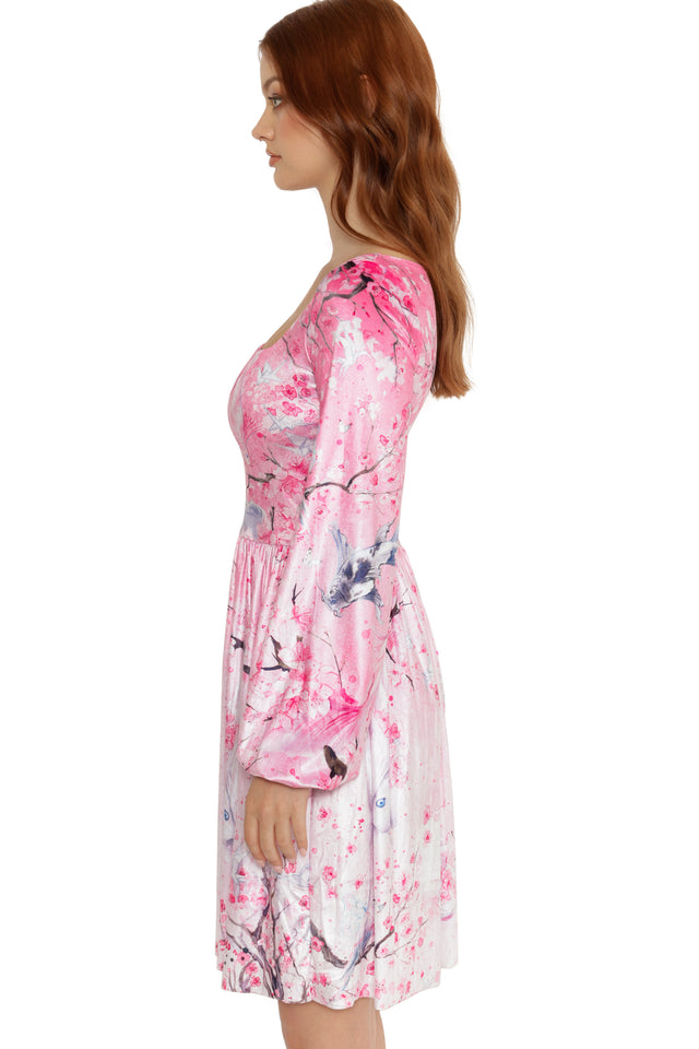 Woman wearing a pink floral dress on a white background