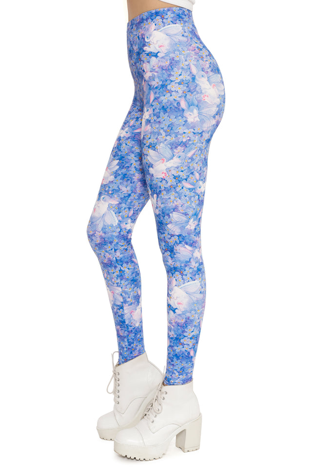 Blue floral leggings worn by a person on a white background