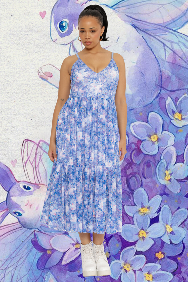 Woman standing in a blue floral mesh dress with bunnies