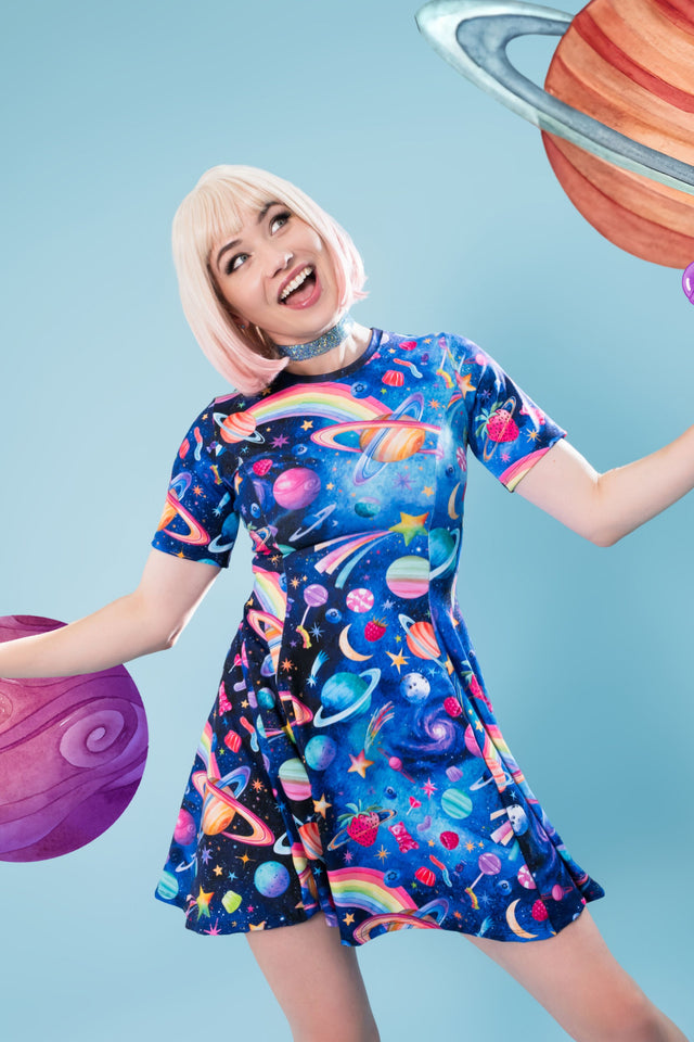 Playful cosmic skater dress featuring rainbow planets, stars and whimsical space details