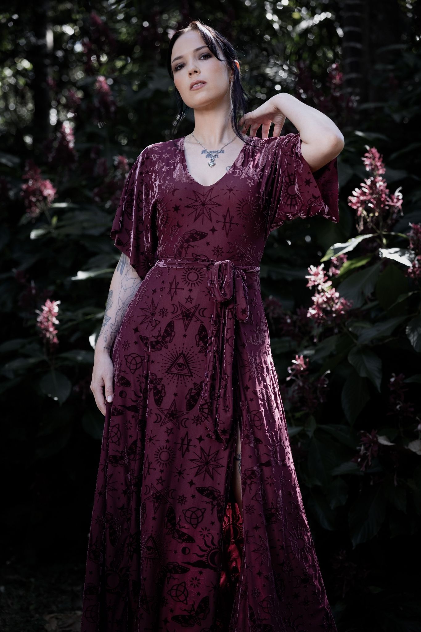 Gothic witch maxi dress with berry burned velvet, celestial sigils and flowing kimono sleeves inspired by mystical spellbook aesthetics. Featuring a fitted V-neck bodice and thigh-high split, this whimsigoth dress is perfect for fantasy witch and alternative goth styling.