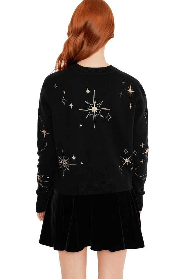 Black knit cardigan with metallic gold starburst embroidery and a classic V-neck silhouette